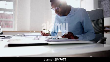 Fraud Investigation And Tax Audit. Investigator Or Auditor Stock Photo