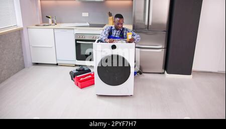 Washing Machine Appliance Repair And Install Stock Photo