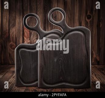 Two Black Burned Ash Tree Vintage Wooden Chopping Boards Stock Photo