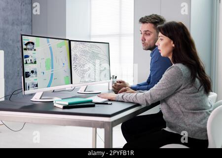 Developer Looking At Land Plot Map Stock Photo