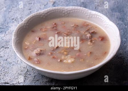 Traditional delicious Turkish food, Turkish traditional tripe soup; iskembe corbasi and offal soup, Turkish Meat Soup Kelle Paca (Turkish name; Kelle Stock Photo