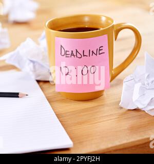 Cant think of anything. a broken pencil and notepad surrounded by crumpled paper. Stock Photo