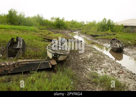 Ondo State, Nigeria - May 2nd, 2023 - Boats parked at the polluted waterway of Abereke Riverine area of Ilaje Community of Ondo State, Nigeria. Stock Photo