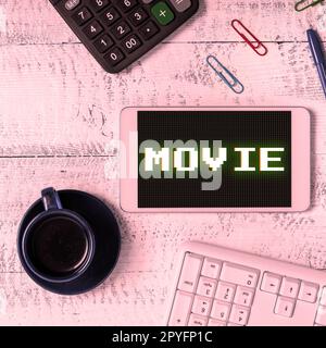 Hand writing sign Movie. Business idea Cinema or television film Motion picture Video displayed on screen Stock Photo