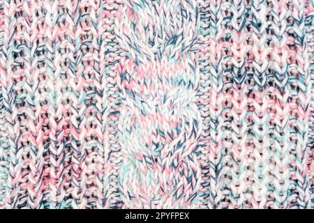 Melange woolen knitted sweater fabric, texture, background. Stock Photo