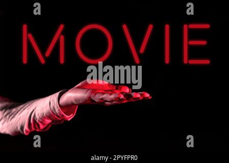Hand writing sign Movie. Business overview Cinema or television film Motion picture Video displayed on screen Stock Photo