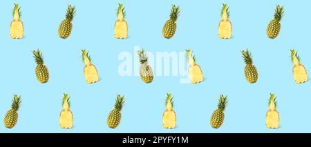 Many ripe pineapples on light blue background. Pattern for design Stock Photo