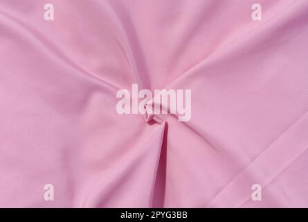 Fragment of pink silk fabric with waves, full frame Stock Photo