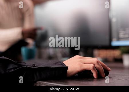 Software developer typing machine learning html code on computer, sitting at desk table in it security agency. Programming engineer working on database system with data script. Close up Stock Photo