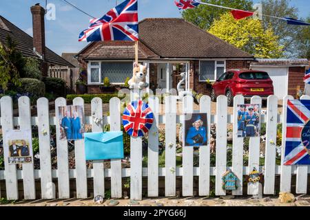 A typical UK suburban house bedecked with flags and bunting for the coronation of King Charles and Queen Camilla. Stock Photo