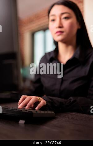 Software developer programming html server code algorithm on computer, sitting at desk in it agency office. Programming engineer working with html database script in cyber security agency. Stock Photo