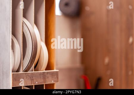 Variety of wooden like tiles. Samples of fake wood tiles for flooring.  Assortment of floor laminate / tiles in an interior shop. Stock Photo