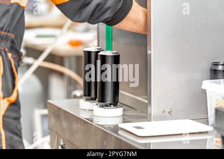 beer filled beverage cans in a brewery Stock Photo