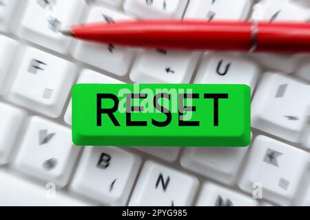 Handwriting text Reset. Word for cause device return to its factory mode Set again zero start point Stock Photo
