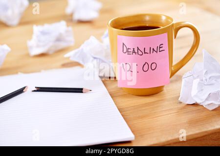 Writers block is the ultimate deadline dilemma. a broken pencil and notepad surrounded by crumpled paper. Stock Photo