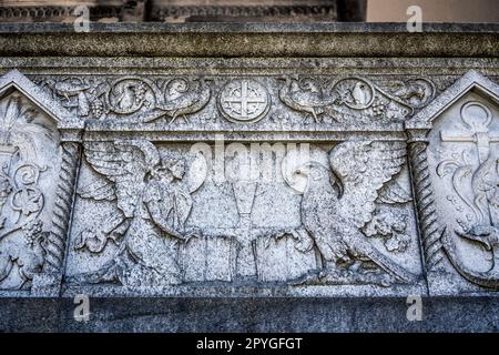 Bas-relief (grave of Longhi spouses) with angel and eagle on a grave in the Monumental Cemetery of Milan, Italy, where many notable people are buried. Stock Photo