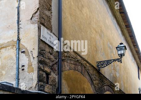 Plaque pointing 'Costa San Giorgio', a picturesque steep street in Florence city center, Tuscany region, Italy Stock Photo