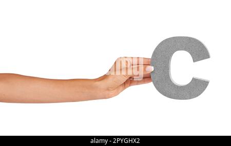 For all to C. A young woman holding a capital letter C isolated on a white background. Stock Photo