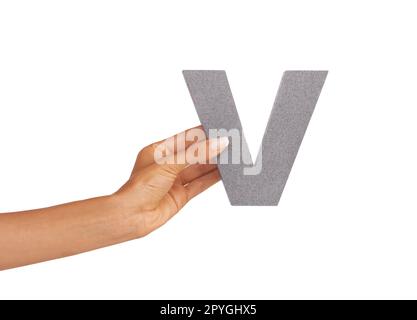 A very presentable V. A young woman holding a capital letter V isolated on a white background. Stock Photo