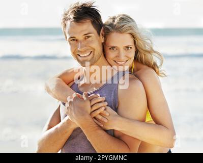 For you Ill cross my heart. a couple posing with hands cossed and holding each other. Stock Photo