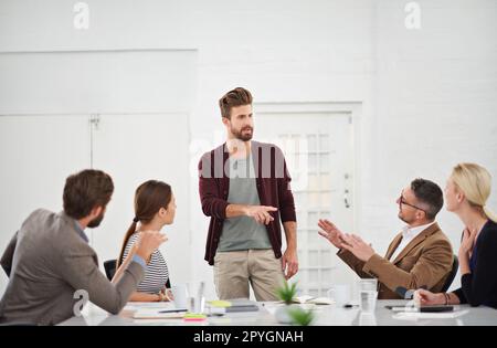 Everyones got an idea. a group of businesspeople in the boardroom. Stock Photo