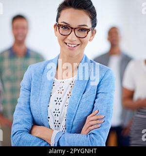 Feeling good about my future prospects. Young businesswoman posing confidently, smiling at the camera. Stock Photo