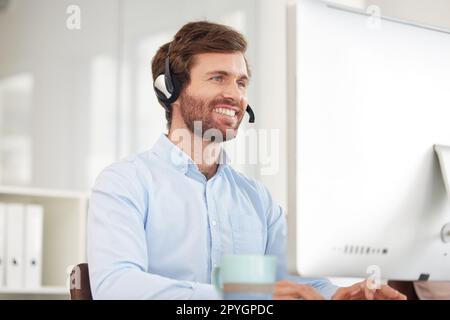 Call center, computer and businessman with smile for virtual support, communication and software help in information technology office. Happy corporate worker with technology for telemarketing sales Stock Photo