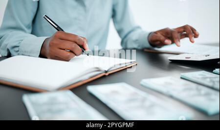 Finance, money and business hands with calculator for budget, savings and financial investment planning. Accounting, cash and notebook of accountant or businessman writing growth strategy for startup Stock Photo