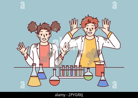 Funny children in laboratory raise hands after unexpected reaction when mixing chemical reagents that caused explosion. Children doing science experim Stock Photo