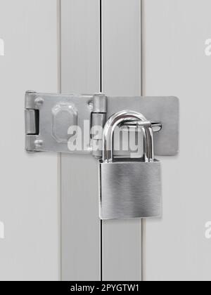 Closed padlock on a metal door Stock Photo
