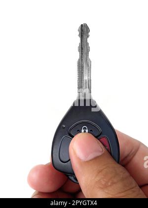 Hand with a car key. Isolated on white background Stock Photo