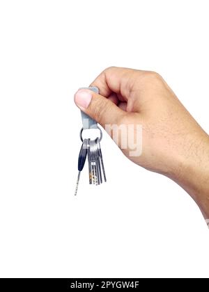 The man holds the keys in hand on a white isolated background Stock Photo