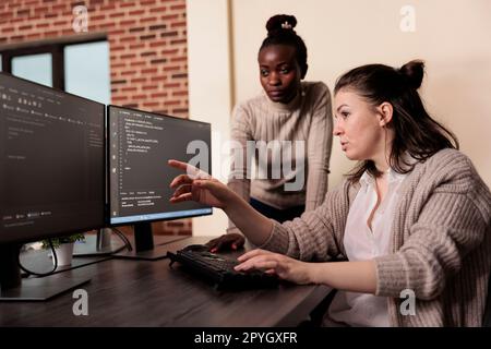 Team of software developers talking about programming in it development agency. Artificial intelligence cloud programers compiling app language innovating online server algorithms. Stock Photo