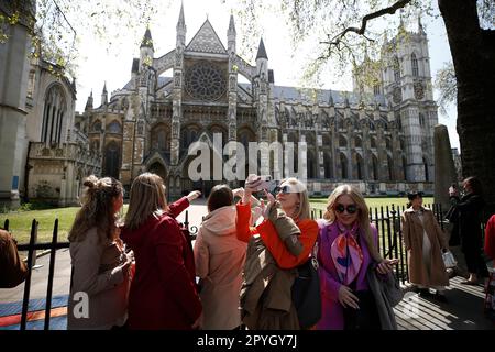 London England, 03/05/2023, People walk past The Westminster Abbey ahead of the Coronation on May 3 2023 in London England, UK. On May 6 thousands form around the world are expected to line the traditional but abbreviated route between Buckingham Place and Westminster Abbey during the Coronation of King Charles III and Queen Camilla (Photo by John Lamparski/NurPhoto) Credit: NurPhoto SRL/Alamy Live News Stock Photo