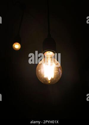 Light bulb on black background Stock Photo