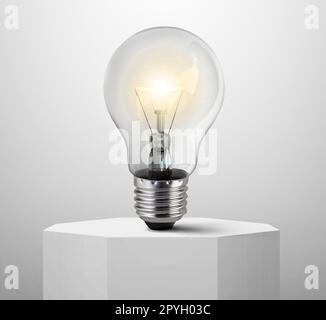 lighted bulb, on Shiny white round pedestal podium Stock Photo