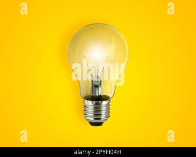 light bulbs on bright yellow background in pastel colors simple Stock Photo