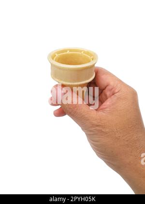 hand holding blank crispy ice cream cone isolated on white background Stock Photo