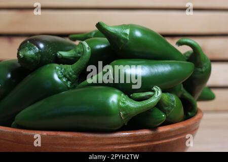 Bowl of Fresh Green Jalapeno Peppers in Rustic Kitchen Stock Photo