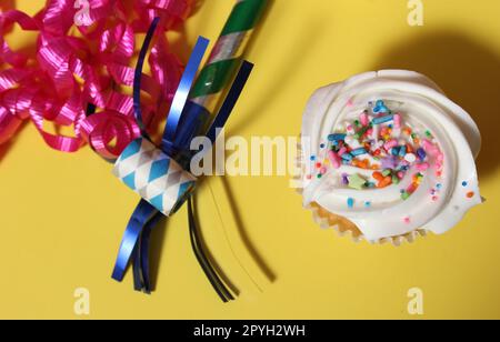 Cupcakes on Table at Party on Yellow Table Stock Photo