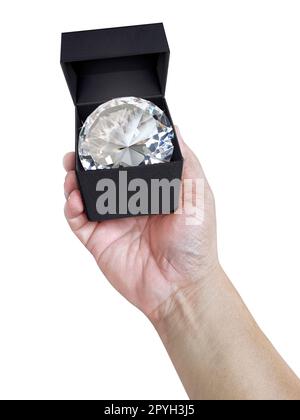 Dazzling diamond in a gift box on hand Stock Photo