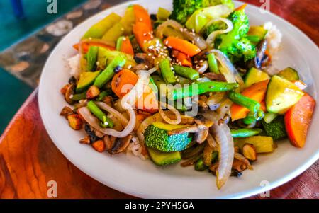 Fried rice and vegetables on white plate Puerto Escondido Mexico. Stock Photo