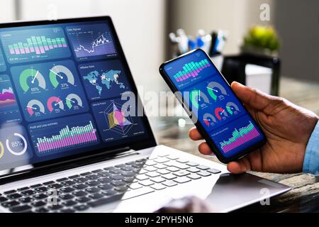 African Advisor Using KPI Dashboard Stock Photo