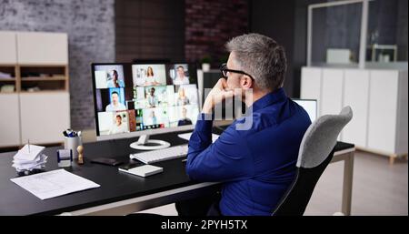 Bored Employee In Video Conference Training Stock Photo