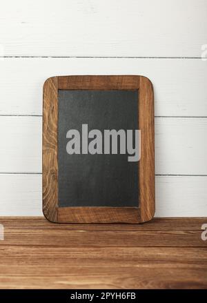 Blank slate chalkboard sign with wooden frame Stock Photo