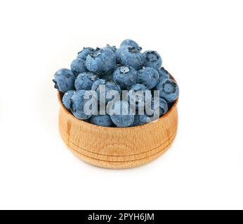 Blueberries in wooden bowl close up over white Stock Photo