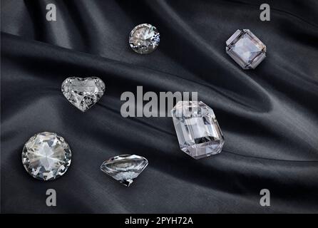 diamond on black fabric background Stock Photo