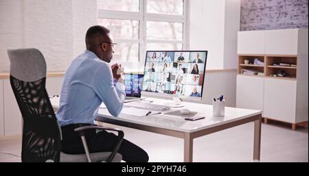 Online Video Conference Webinar. Man Working Stock Photo