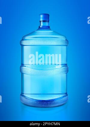 A large bottle of pure water on blue background Stock Photo
