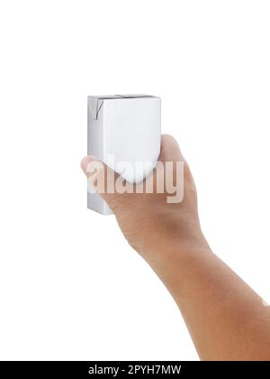 carton of milk or juice package in hand isolated on white background Stock Photo